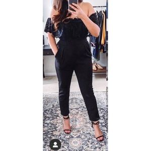 Express over the shoulder lace jumpsuit.